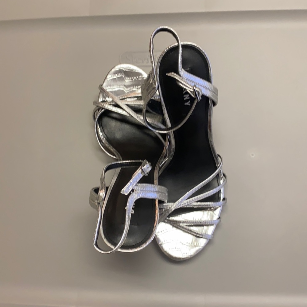Dkny silver silhouette heels sandals.